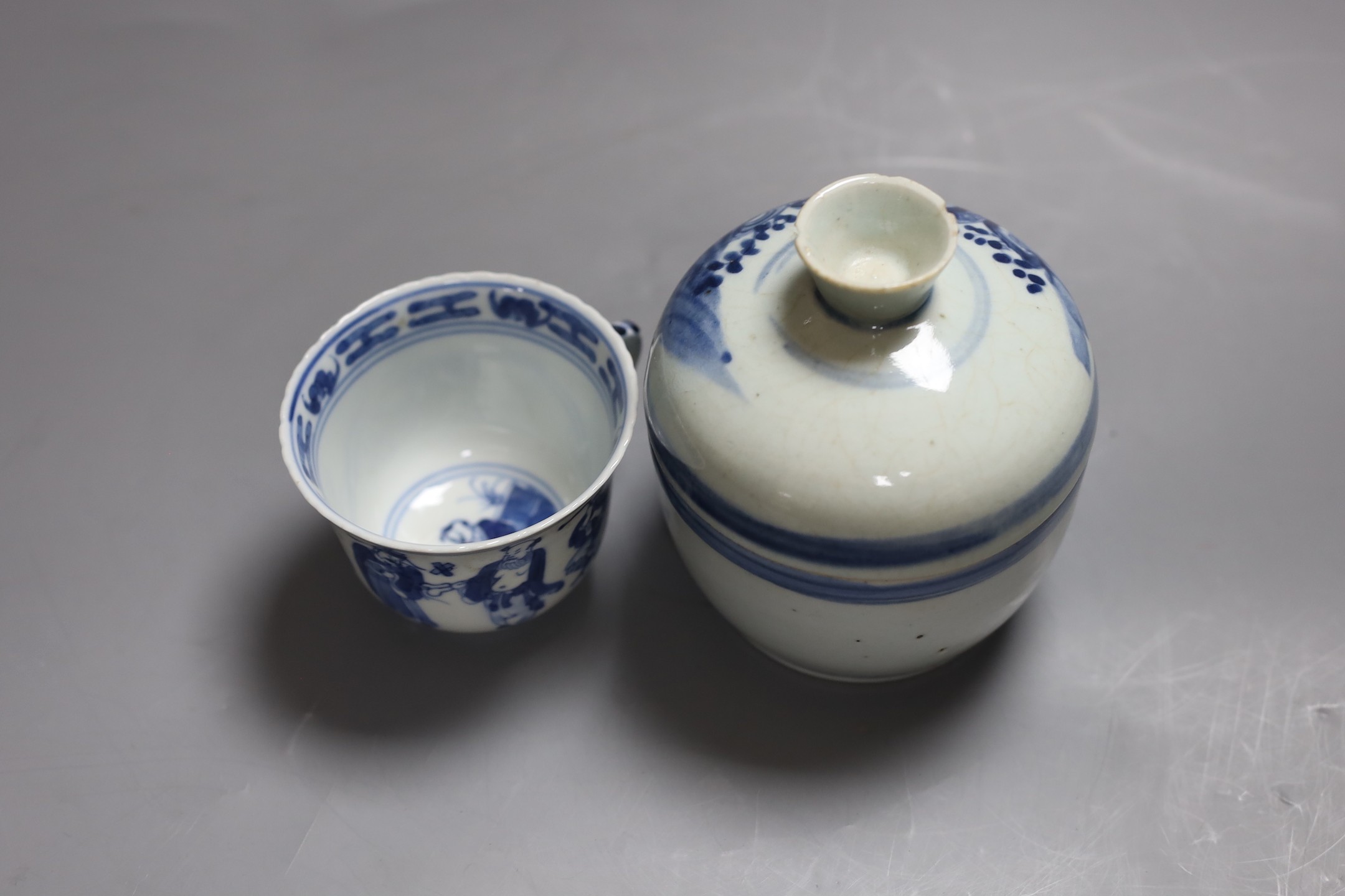 A 19th century blue and white jar with cover and a similar cup, Jar and cover 13 cms high